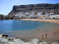 An artificial beach was created at Puerto de Mogan to boost tourism.