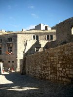 A view of one of Les Baux's streets with some of the remaining ramparts overhead