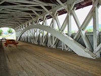 The addition of the arch increased the span of a bridge between supports.